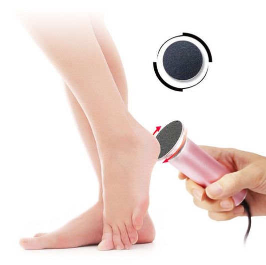Electric pedicure foot care tool in use for removing calluses and dead skin.