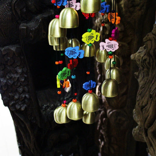 Colorful home wind chime with bells and wooden fish.