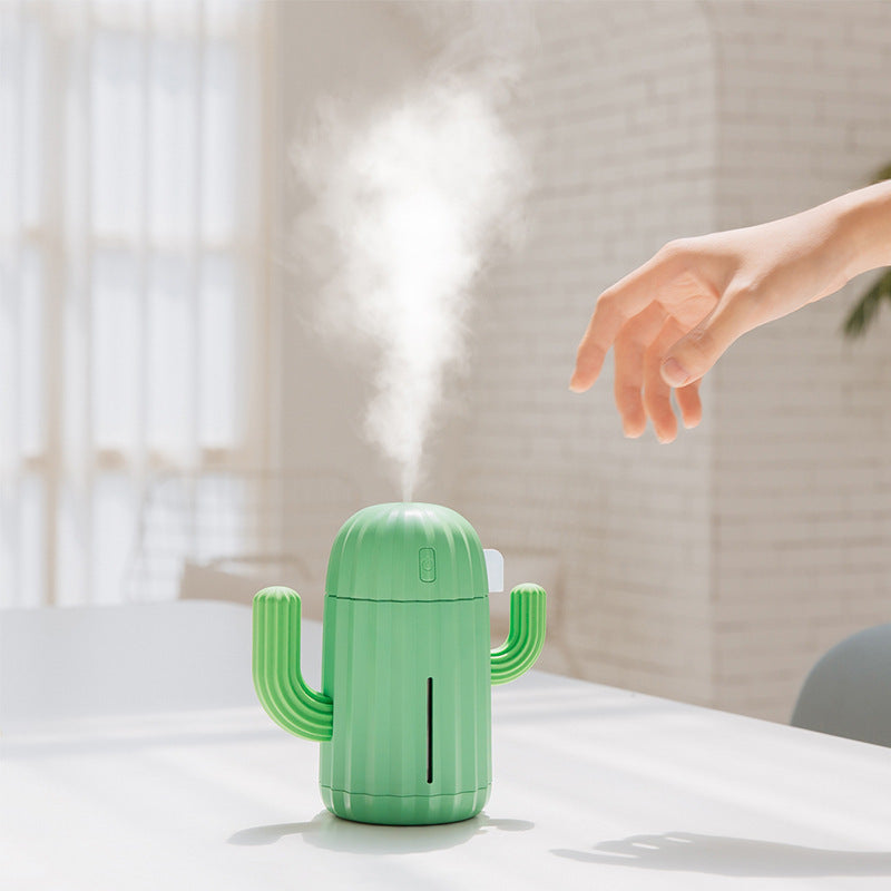 Cactus Wireless Humidifier emitting mist on a table.