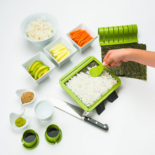DIY simple sushi making machine set with ingredients and utensils.