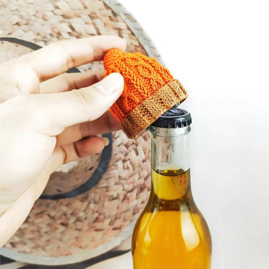 Creative Christmas hat resin beer bottle opener, kitchen gadget in use.